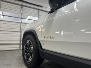 photo of a rivian vehicle in a repair shop